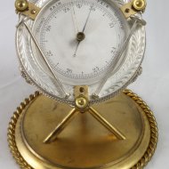 Antieke aneroïde engelse barometer in trommelmodel, verguld en verzilverd.